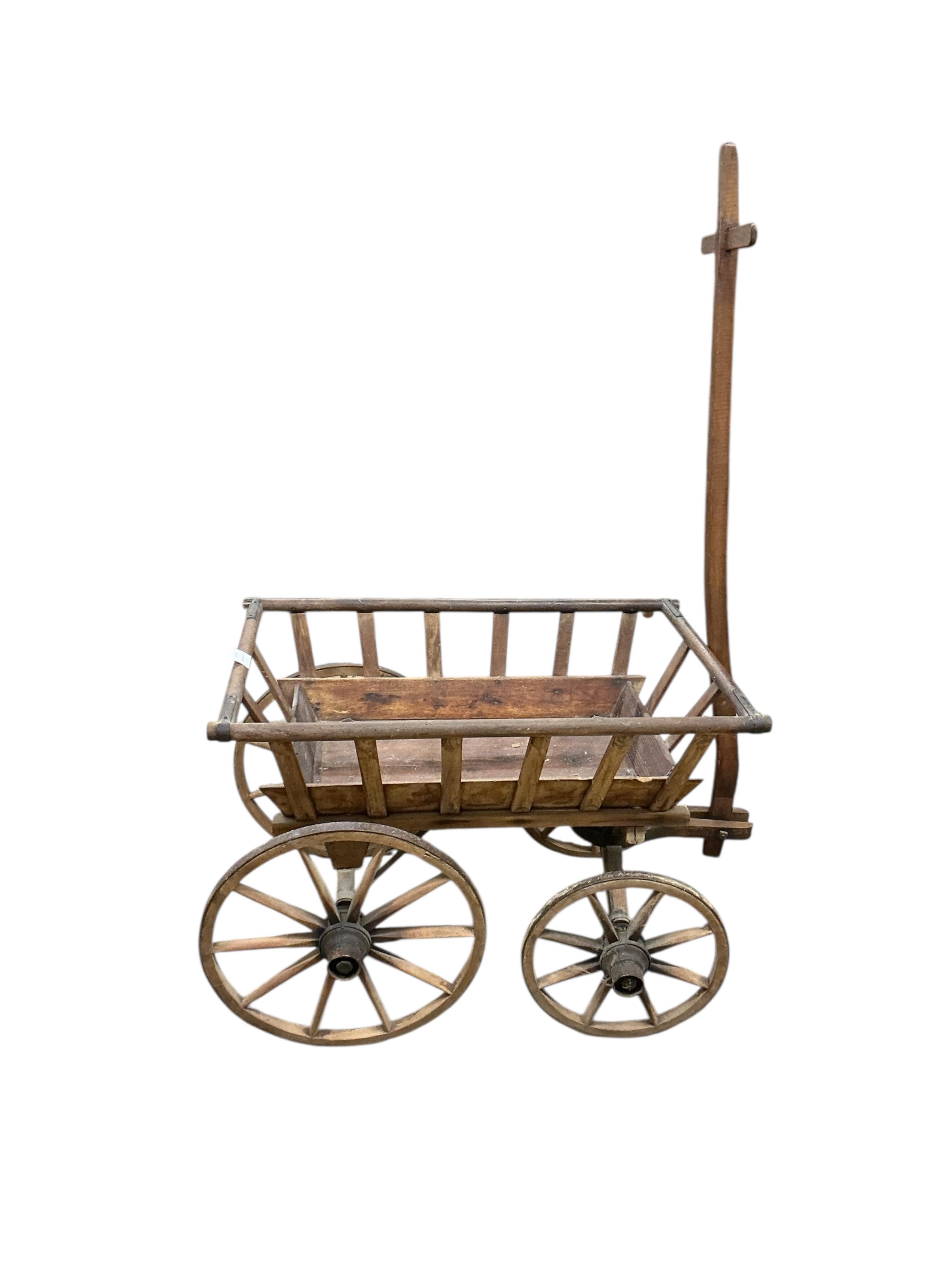 A Victorian iron bound dog cart, length 75cm, width 47cm